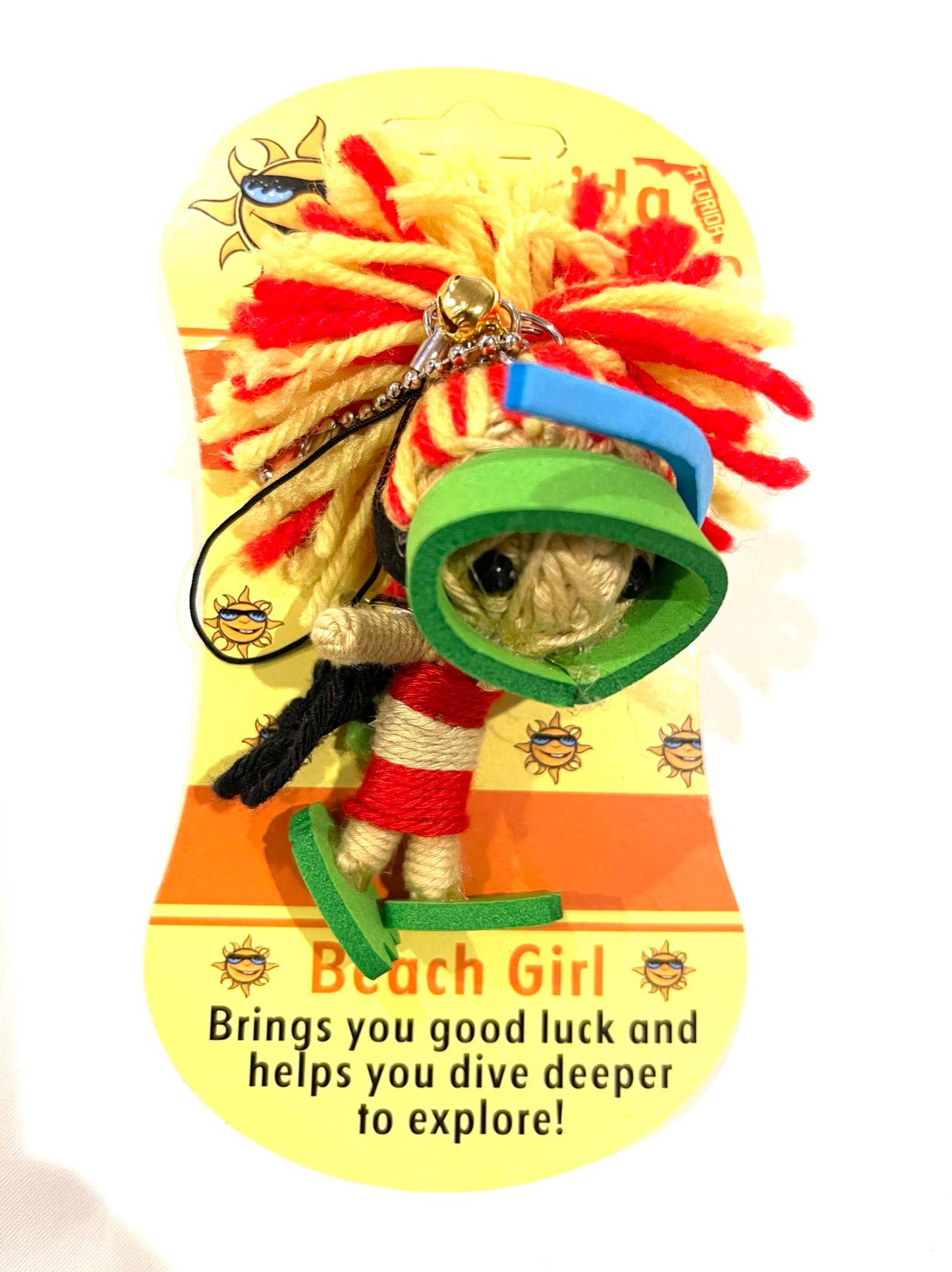 Decorative voodoo doll keychain with a 'Beach Girl' figure on a colorful background