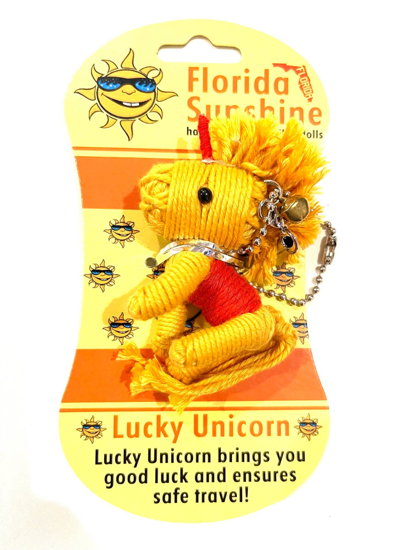 Yellow unicorn voodoo keychain with red mane on a 'Florida Sunshine' branded card.