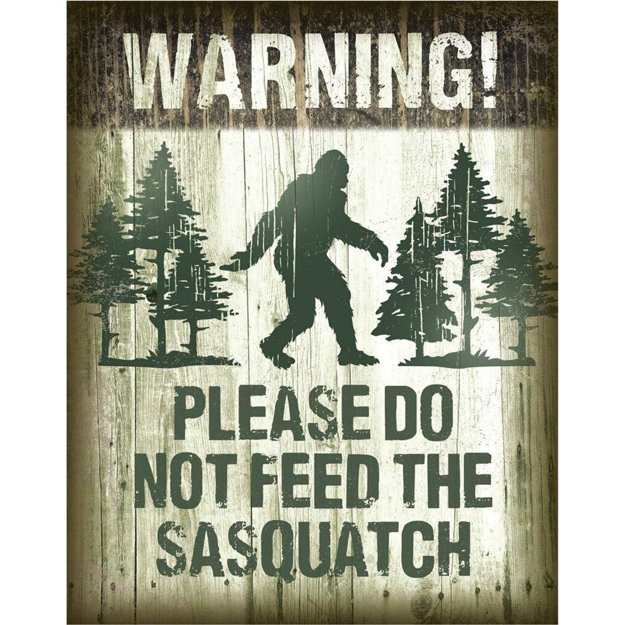 Metal sign with a silhouette of Sasquatch and text 'Warning! Please do not feed the Sasquatch' on a textured background.