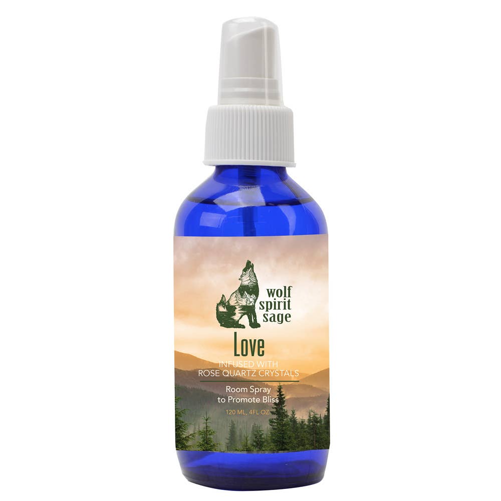 Blue spray bottle with a label featuring a wolf and nature imagery on a white background