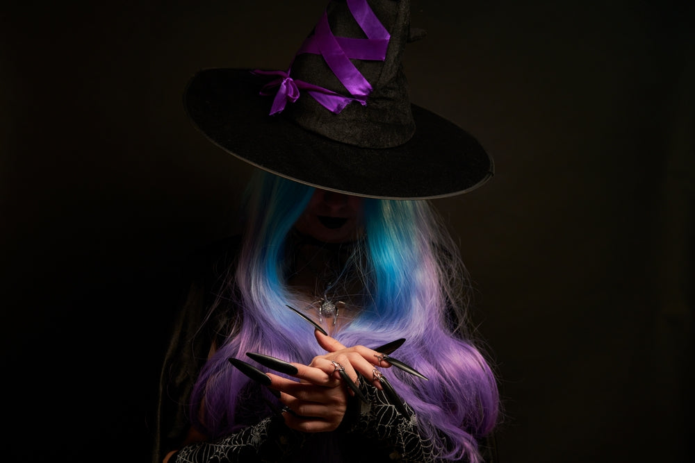Witch with purple and blue hair and purple hat