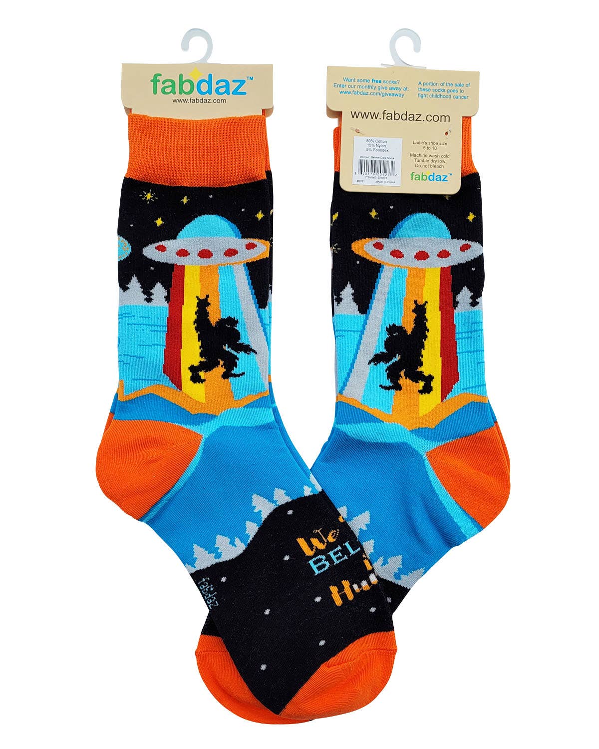 Pair of socks with alien abduction design on a white background, featuring the brand 'fabdaz'.