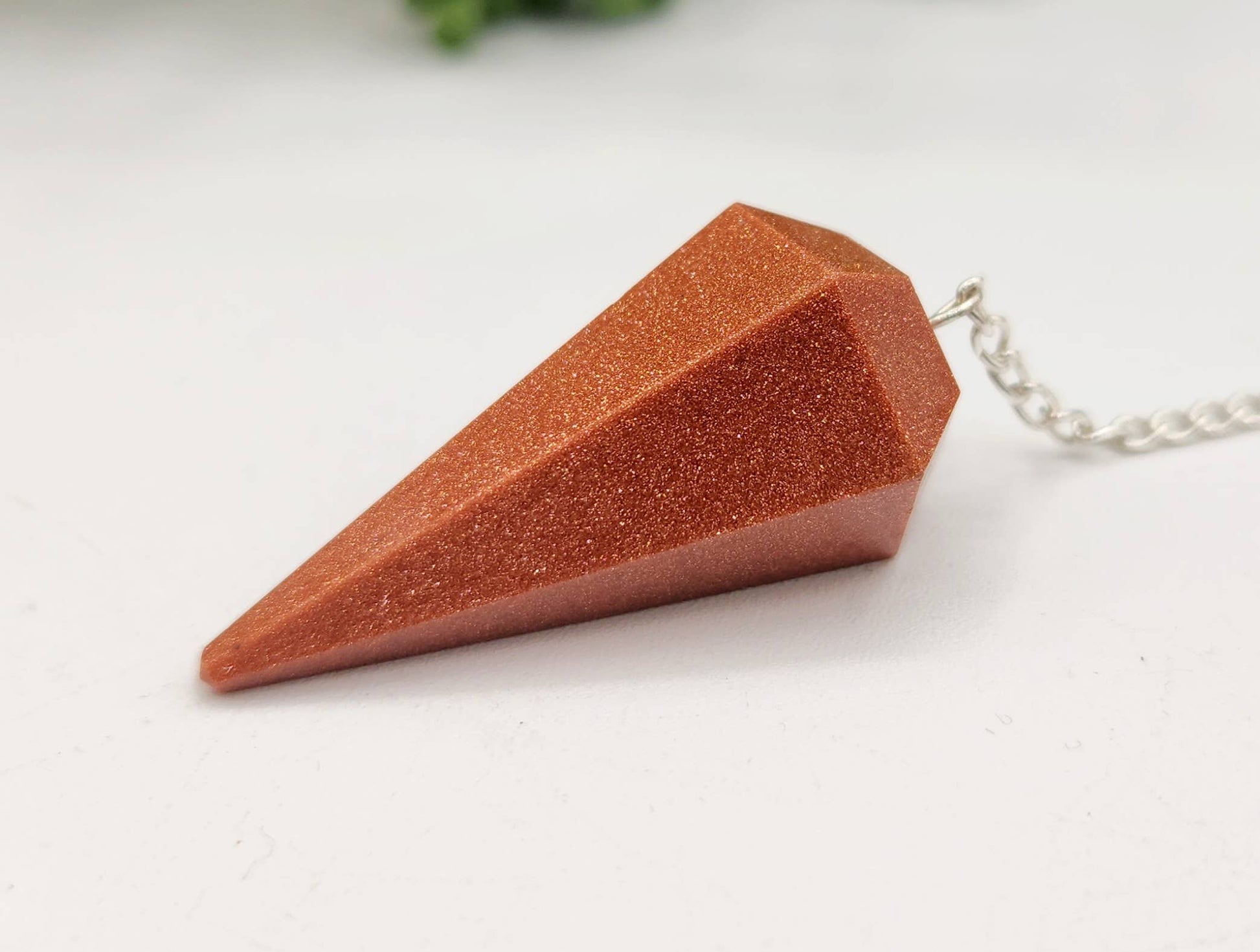 Brown stone pendant on a white background