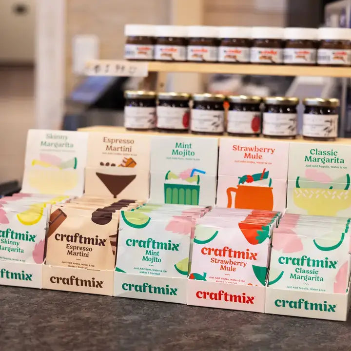 Assorted craftmix boxes on a counter with jars in the background