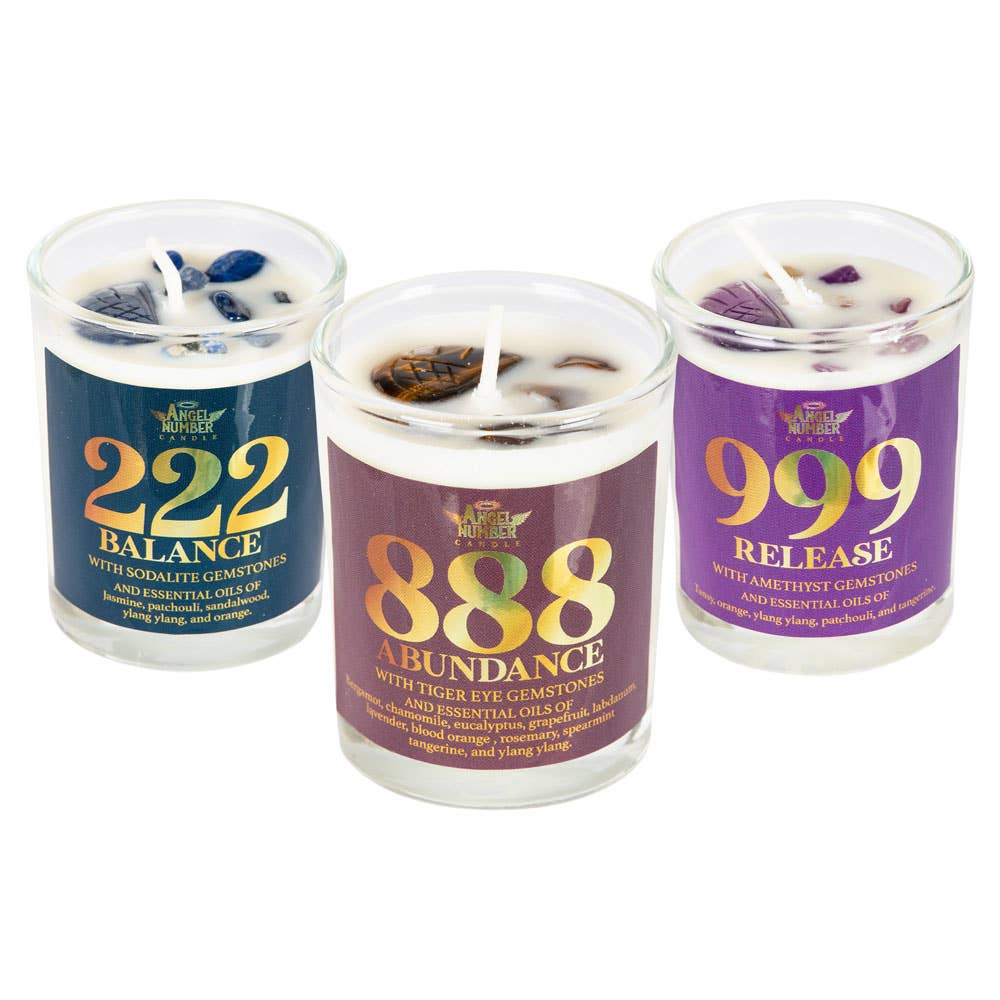 Three candles with colorful labels and text on a white background