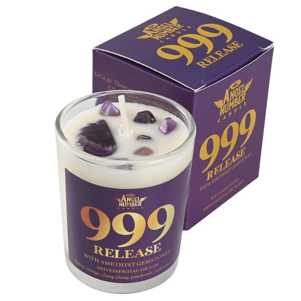 Candle with '999 Release' packaging and amethyst gemstones on a white background