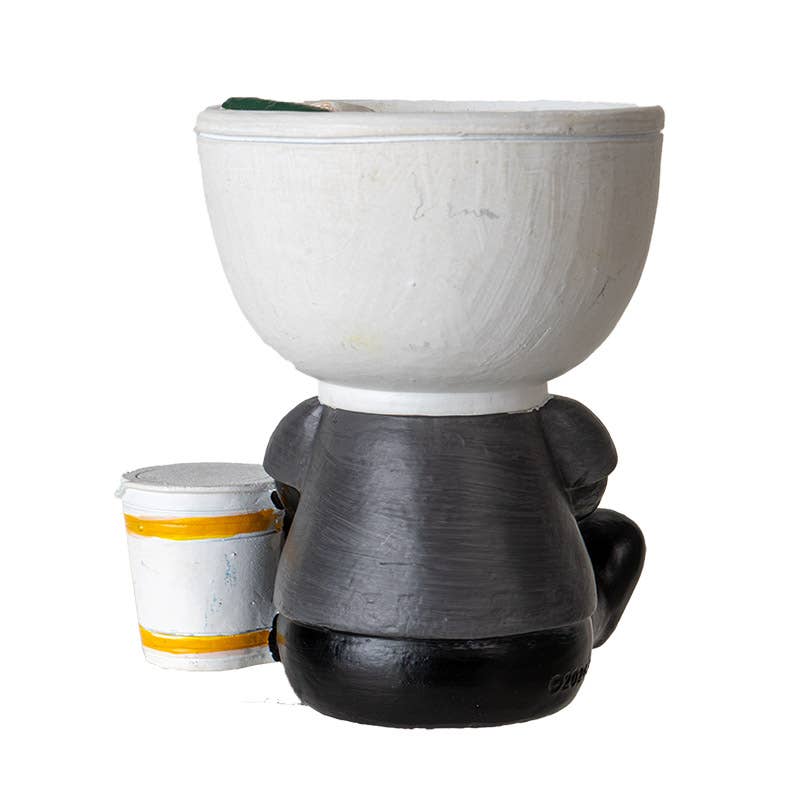 Ceramic planter with black base and white top on a white background