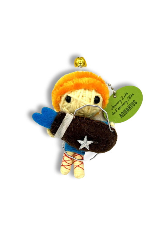 Small plush toy with a yellow hat and blue gloves on a white background