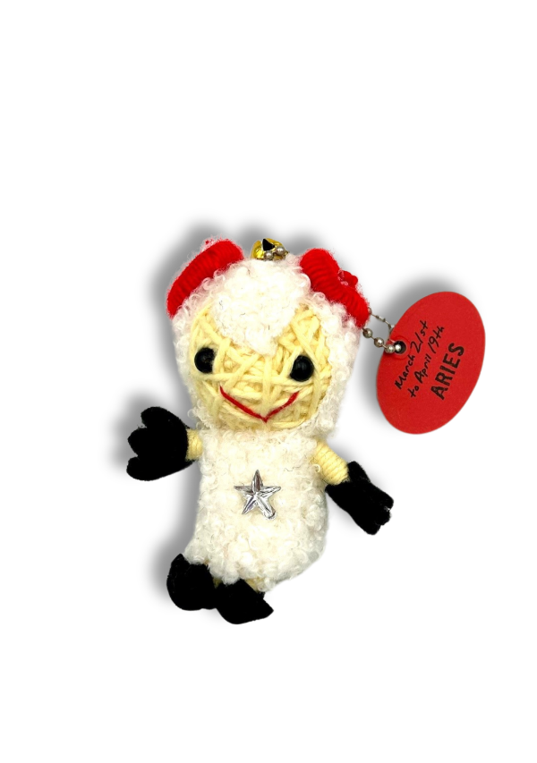 Small plush toy resembling a chicken with a red hat and 'Aries' tag on a white background