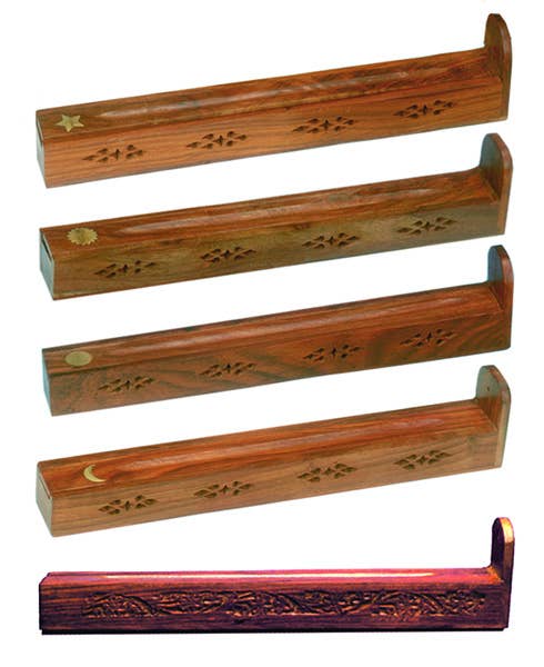 Set of wooden incense holders with intricate carvings on a white background