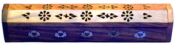 Decorative wooden box with floral patterns on a blue background