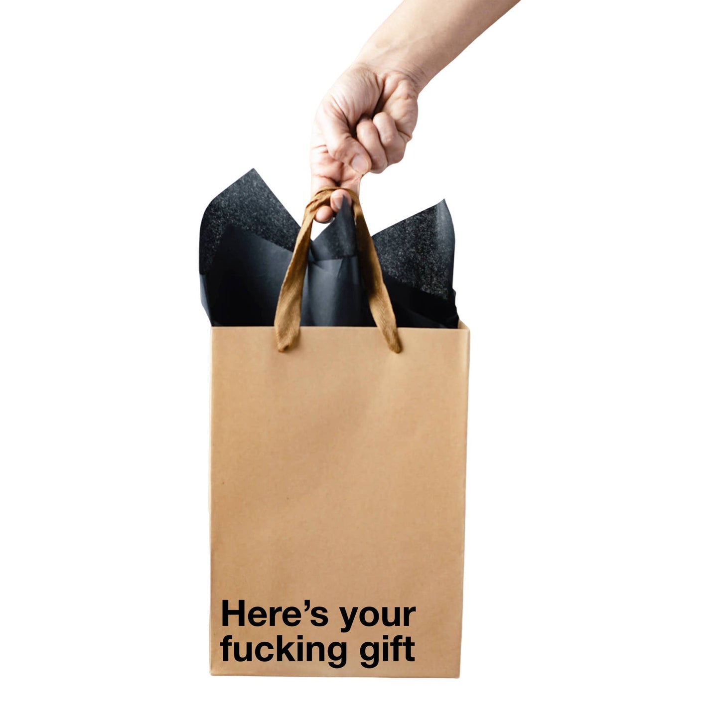Hand holding a brown paper bag with black text and a black item, on a white background