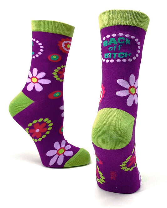 Purple socks with floral designs and green accents on a white background