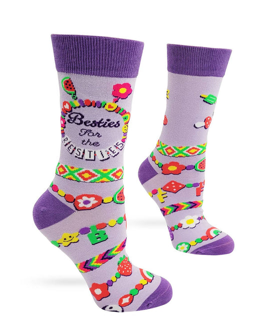 Colorful socks with floral patterns and text on a white background