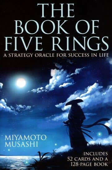 Book cover of 'The Book of Five Rings' with a silhouette of a samurai under a moonlit sky.