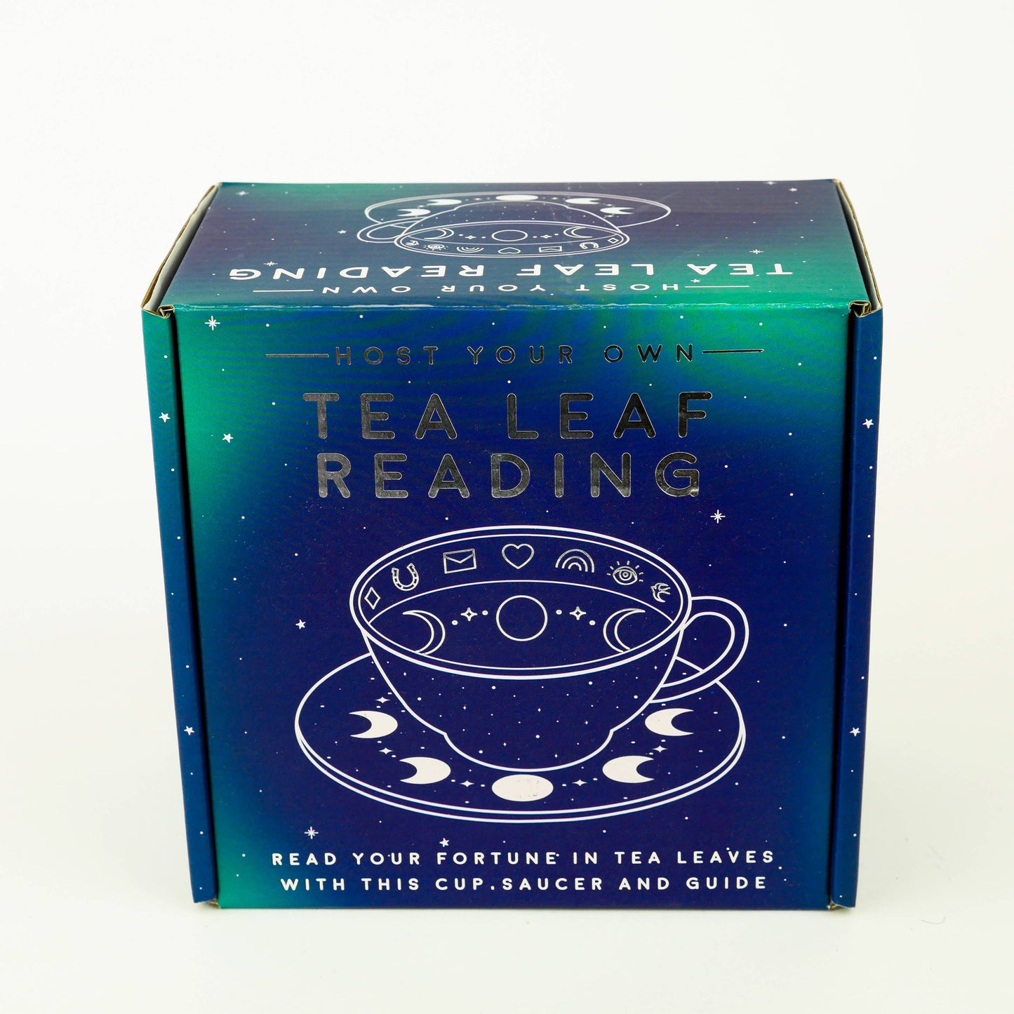 Box for a tea leaf reading kit with text and graphics on a white background