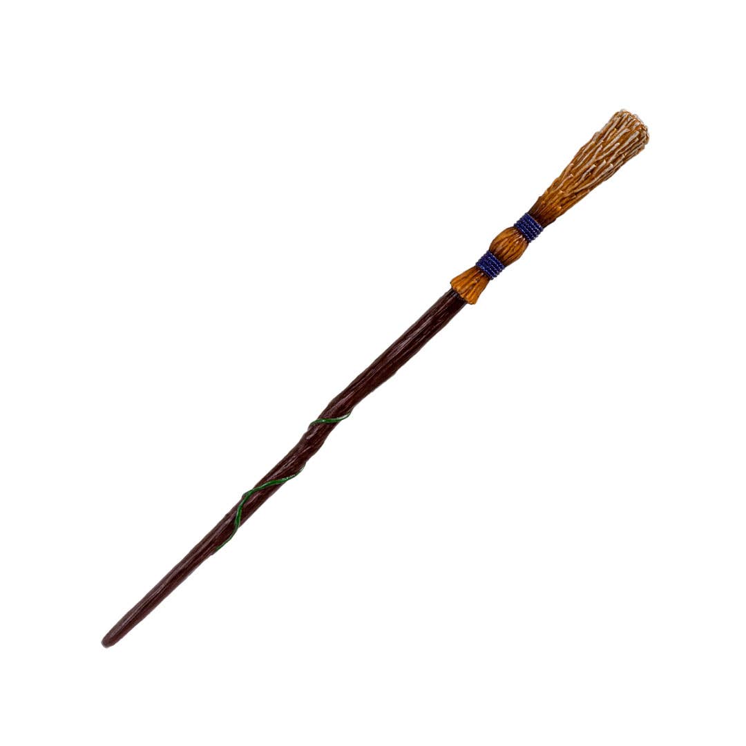 Wooden broom with a decorative top on a white background