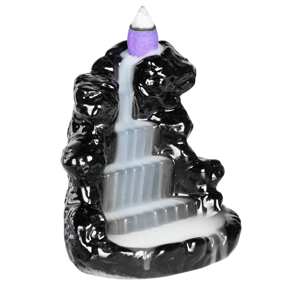 Backflow incense burner with black mountain design on a white background