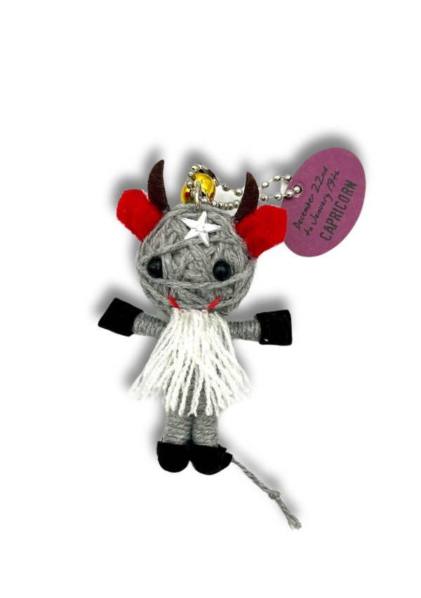 Gray plush toy with red accents and a star on a white background