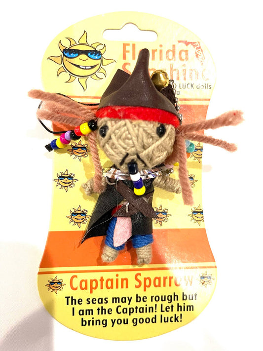 Toy voodoo doll of Captain Sparrow on a packaging card with text and graphics.