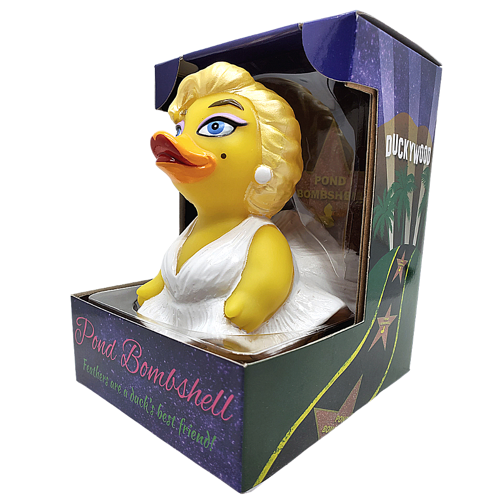 Yellow duck figurine with blonde hair and a white dress in packaging