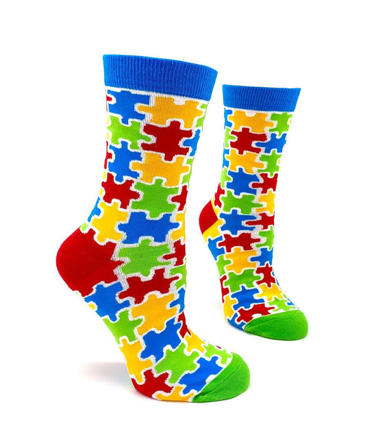 Colorful puzzle-patterned socks on a white background