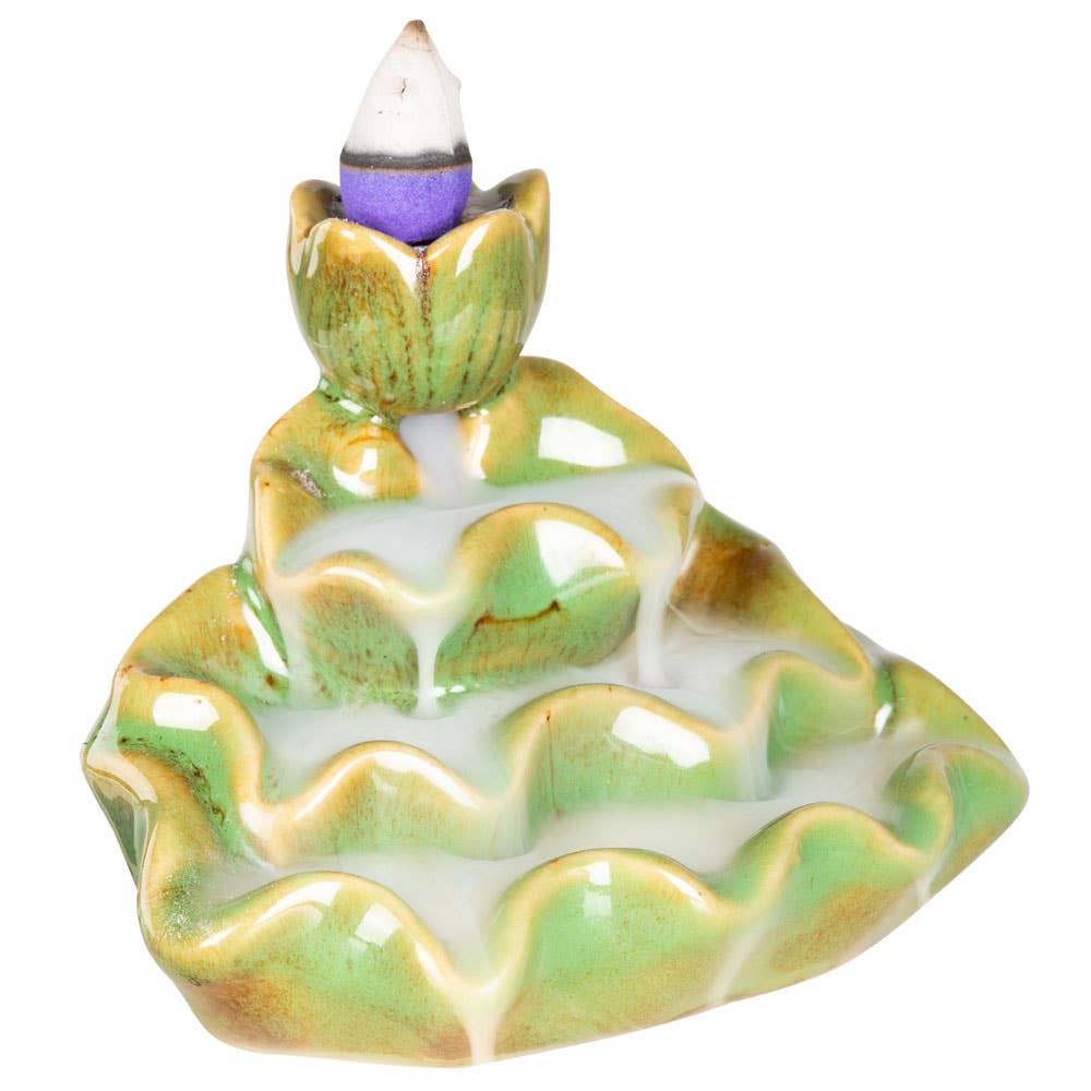 Ceramic incense burner with a purple cone on a white background