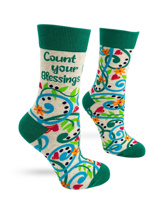 Colorful socks with floral patterns and text 'Count your Blessings' on a white background
