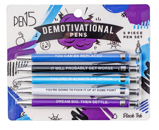 Packaged set of 'Demotivational Pens' with humorous sayings on a colorful background.