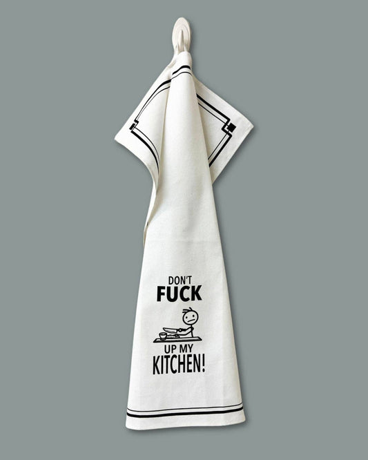 White towel with black text and graphic design on a gray background