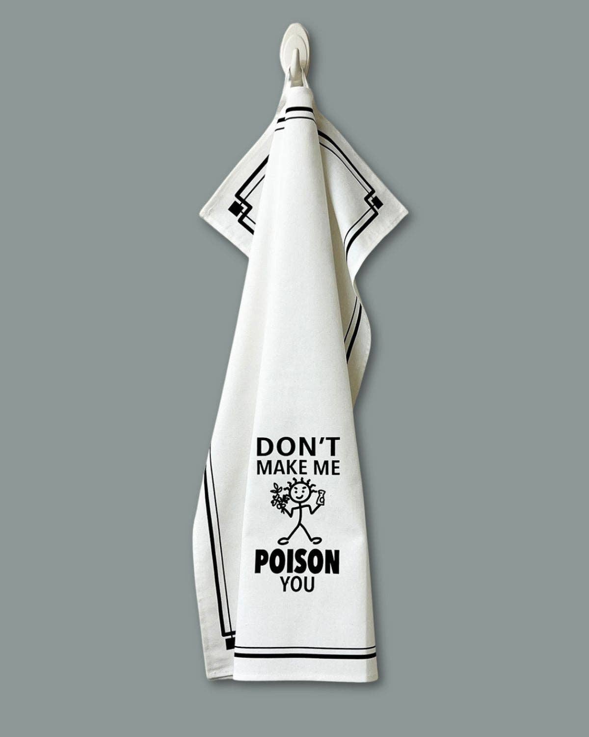 White towel with black text and design on a gray background