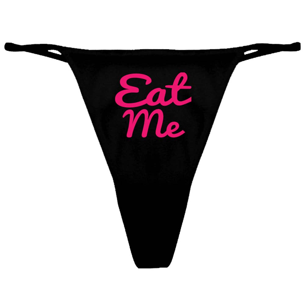 Black thong with pink 'Eat Me' text on a white background