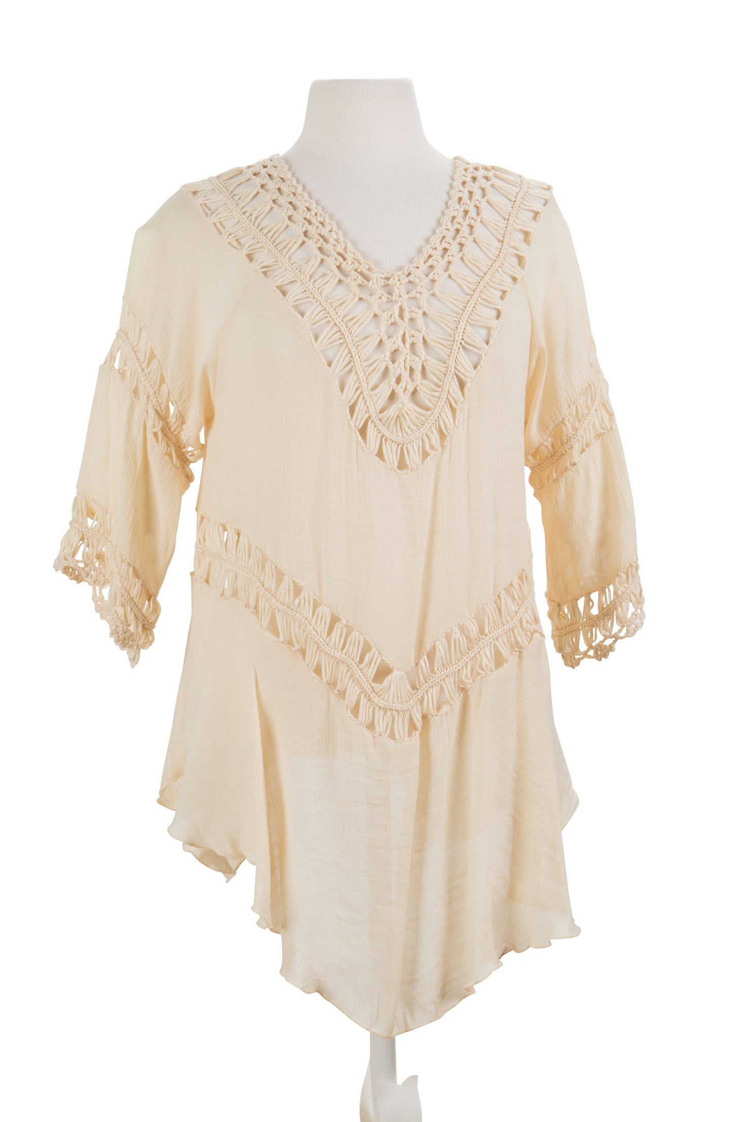 Beige lace top on a mannequin against a white background