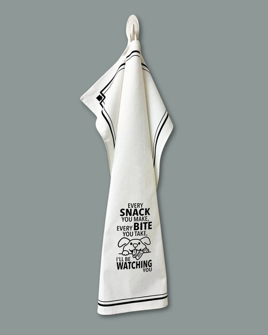 White towel with black text and graphic on a gray background