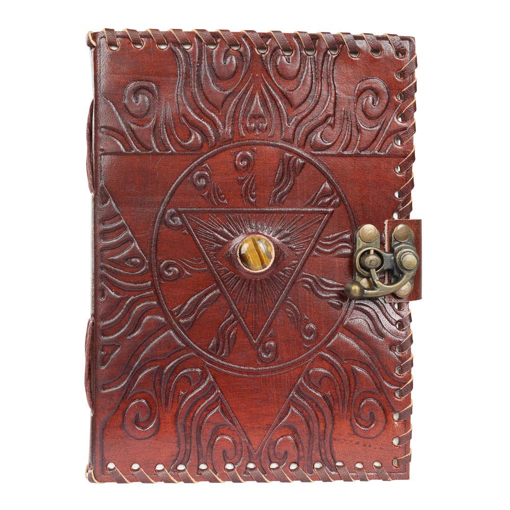 Brown leather journal with embossed design and lock on a white background