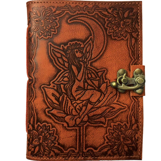 Brown leather journal with embossed fairy design and floral elements on a white background