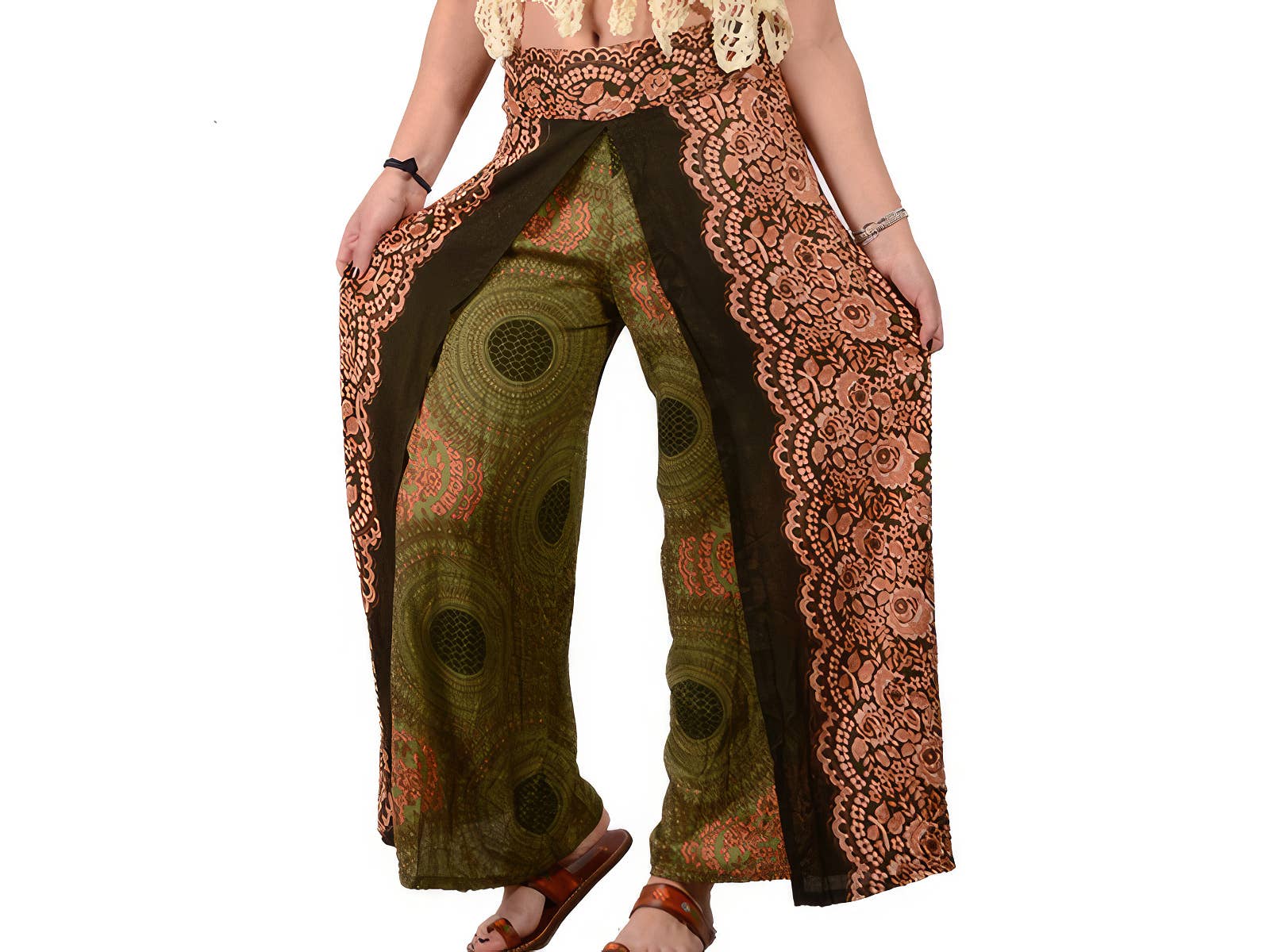 Person wearing a pair of wide-leg pants with intricate patterns on a white background