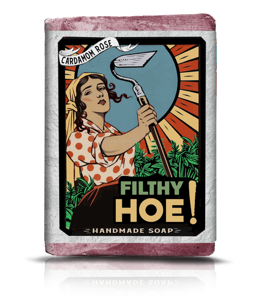 Bar of soap with a graphic design featuring a woman holding a hoe and text on a white background.