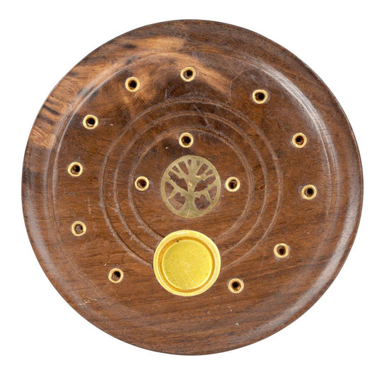 Wooden disc with gold center and circular patterns on a white background