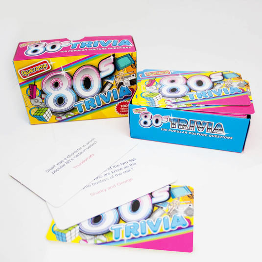 80s Trivia game packaging with cards on a white background