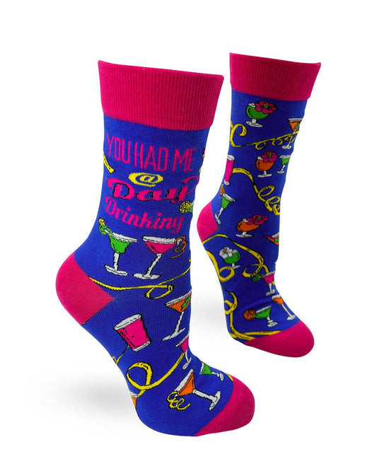 Colorful socks with cocktail-themed design and text on a white background
