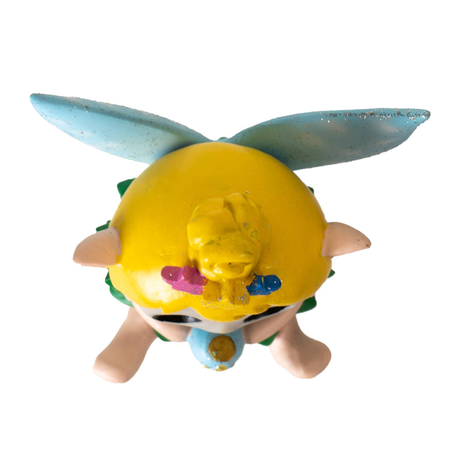 Furrybones Tinker figure with a yellow face and blue wings on a white background