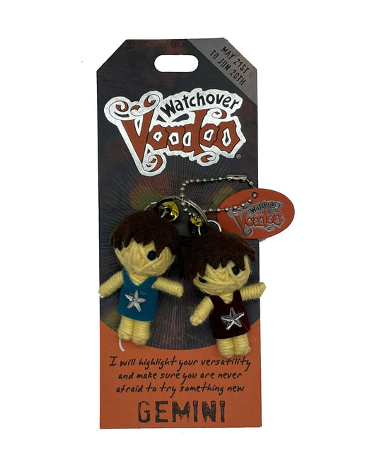 Two small figurines on a 'Watchover Voodoo' branded card with text.