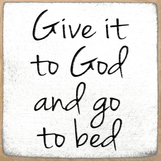 Text 'Give it to God and go to bed' on a textured white background