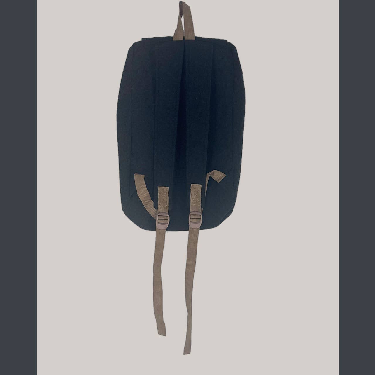Navy blue backpack with brown straps on a light gray background
