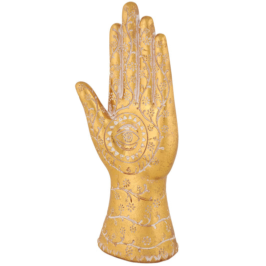 Decorative gold glove with intricate designs on a white background