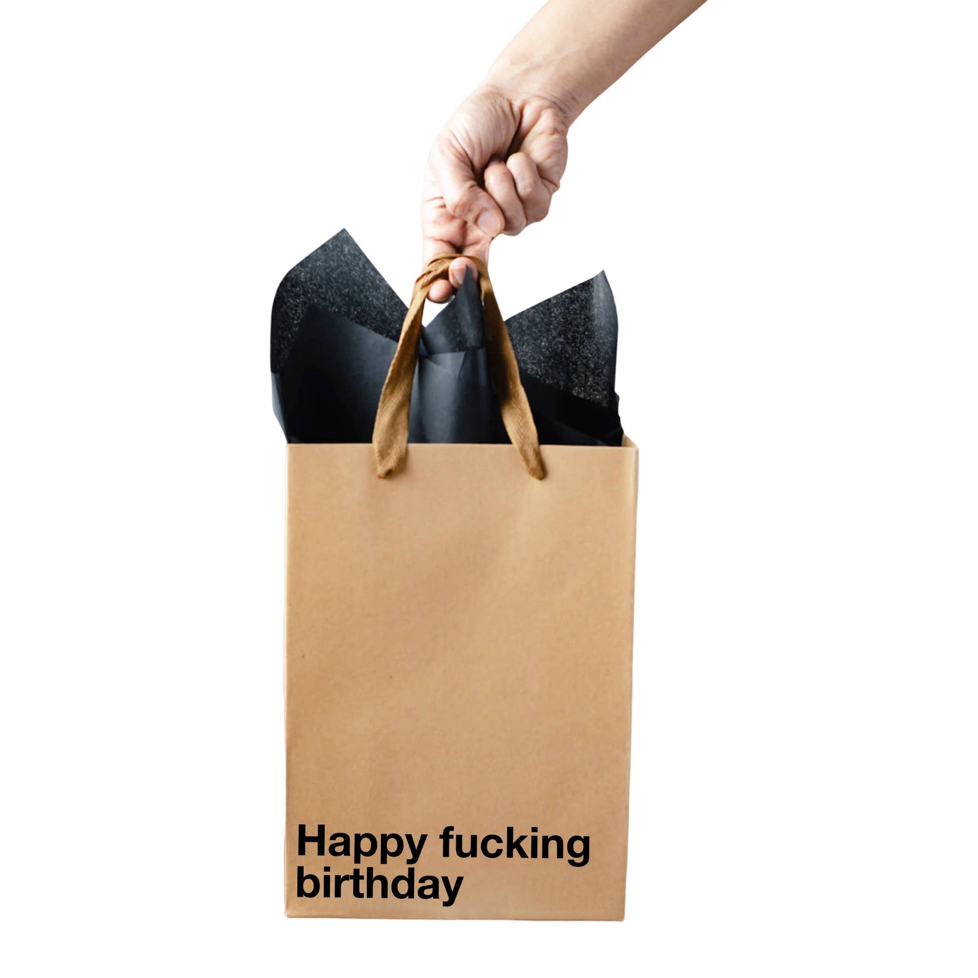 Brown paper bag with 'Happy fucking birthday' text, held by a hand against a white background