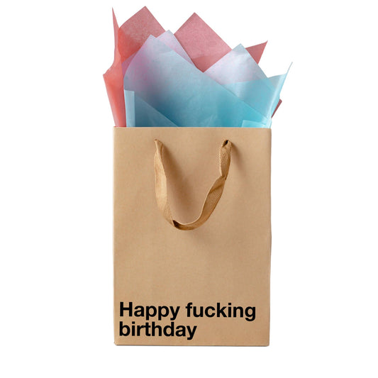 Brown paper bag with 'Happy fucking birthday' text and colorful tissue paper on a white background