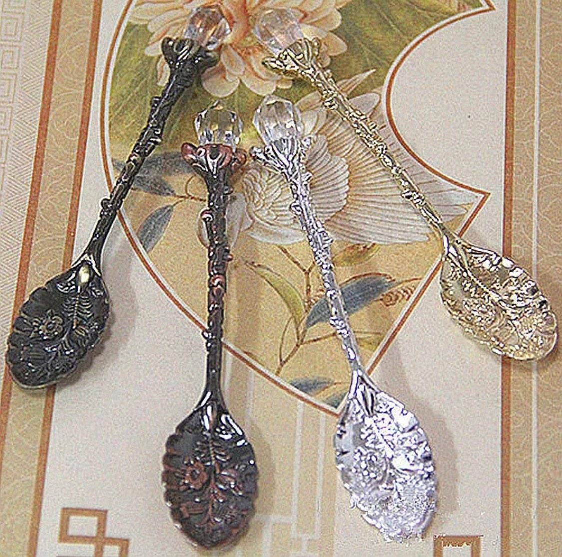 Set of decorative spoons on a floral card