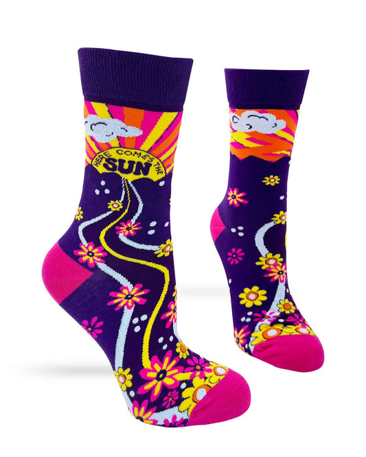 Colorful socks with floral patterns and sun design on a white background